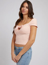 Guess Světle růžové dámské žebrované cropped tričko s mašlí Guess Valeriana